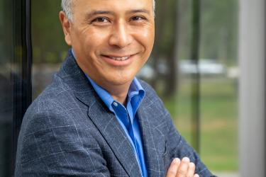 Jon Nakamatsu with his arms folded 